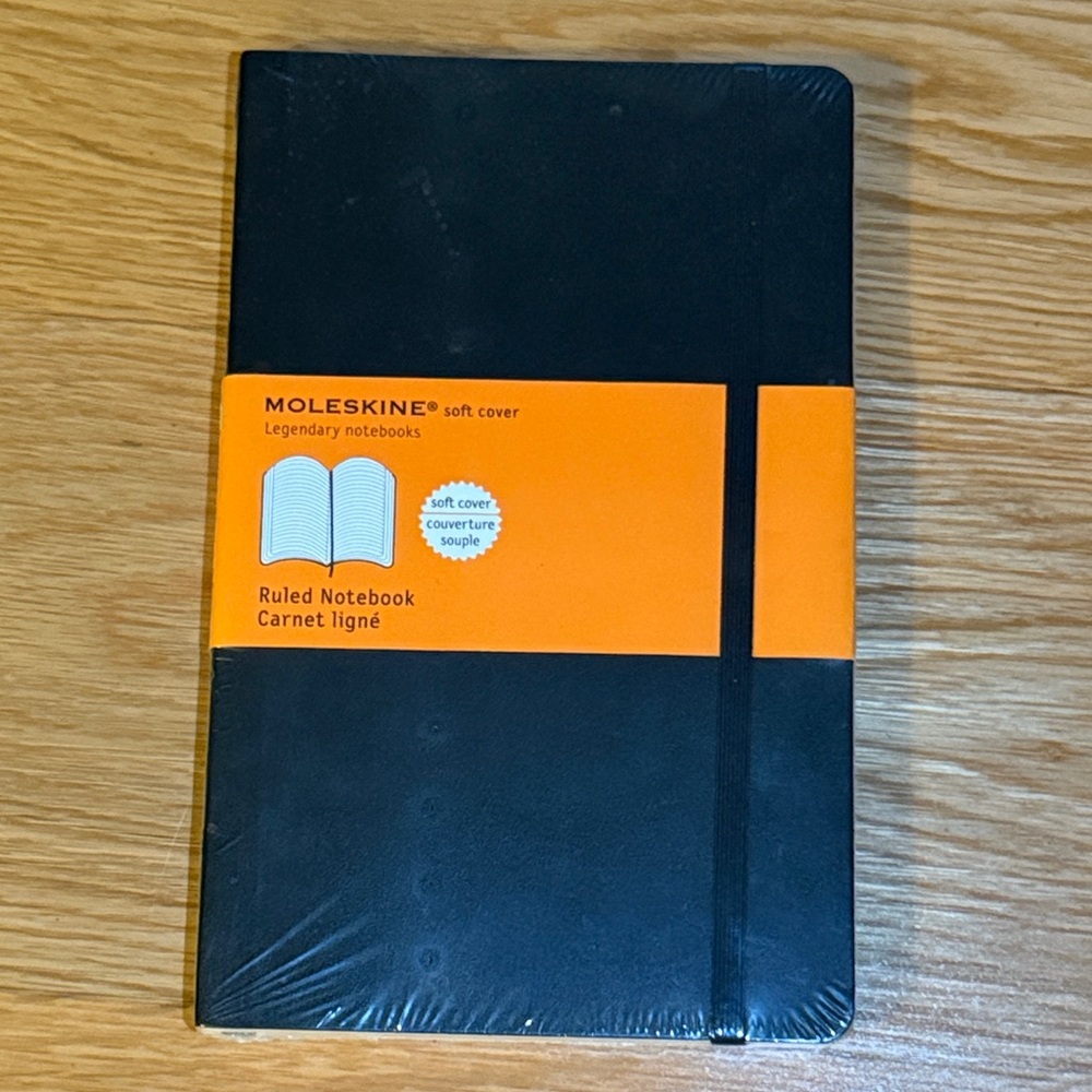 Moleskine Black Soft Cover Ruled Notebook with Orange Band